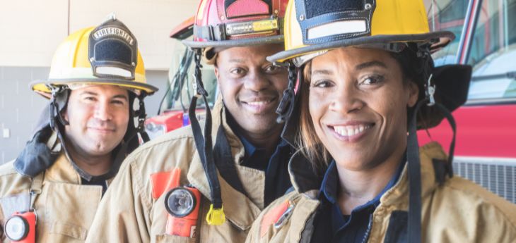 a group of people wearing firefighter helmets